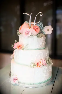 Three Tier Vintage Inspired Wedding Cake with Intricate Piping and Cascading Flowers