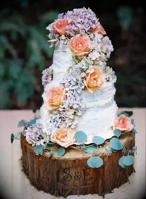 Hydrangea and Rose-Covered Rustic three-tiered Wedding Cake