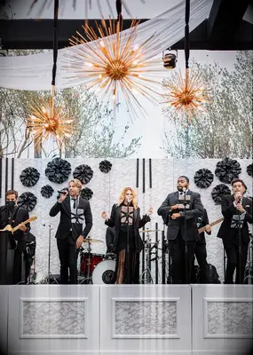 Patterned black-and-white stage backdrop at wedding