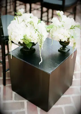 Black and white ceremony floral arrangements 