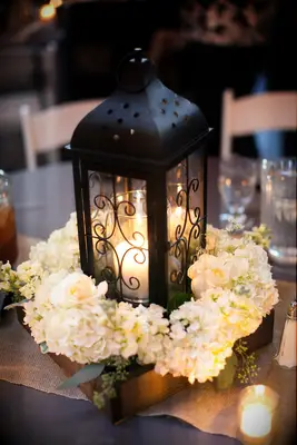 Black lantern and white hydrangea wedding centerpiece