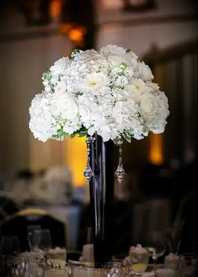 Black and white vase centerpiece at wedding