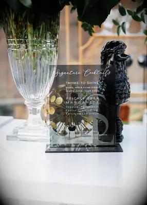 Black and white acrylic bar menu at wedding