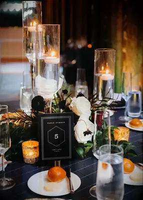 Elegant black and white table number at wedding