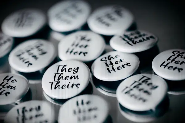 Black and white guest buttons at wedding