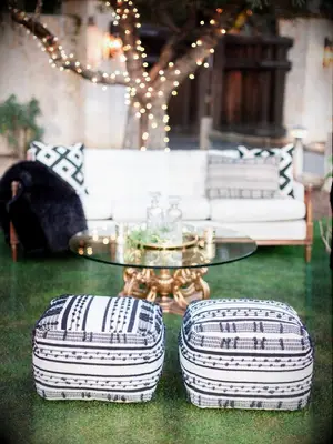 black-and-white ottomans at wedding
