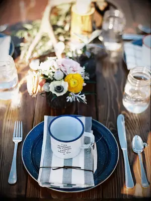 rustic place setting with enamel dishes