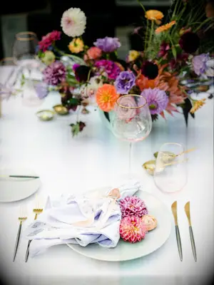 place setting with fresh dahlias