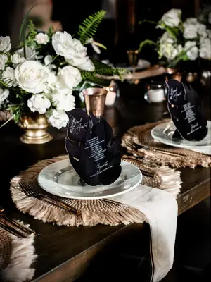 glam black-and-white tropical place setting