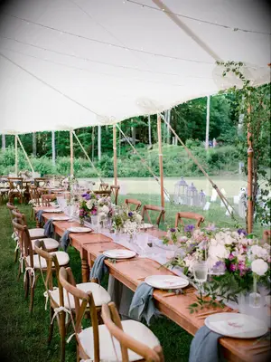 Outdoor summer wedding tent with string lights 