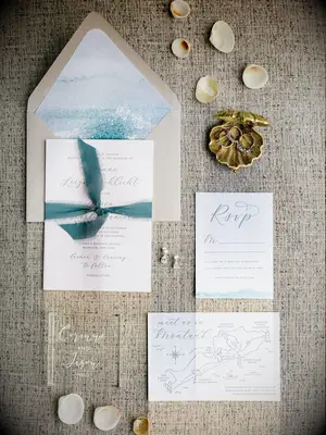 Chic beach-themed blue and gold invitation suite for summer wedding