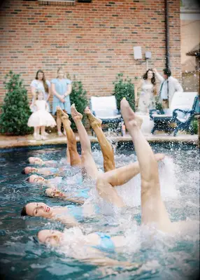Synchronized swimming performance at summer wedding