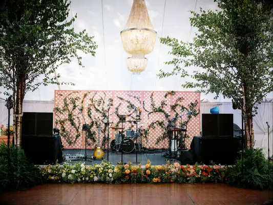 Lush dancefloor decor at summer wedding