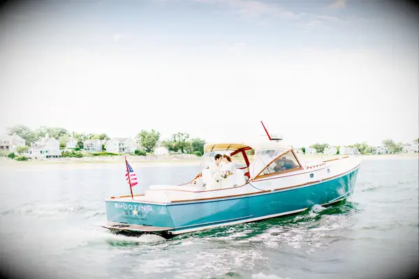 Boat photoshoot at summer wedding