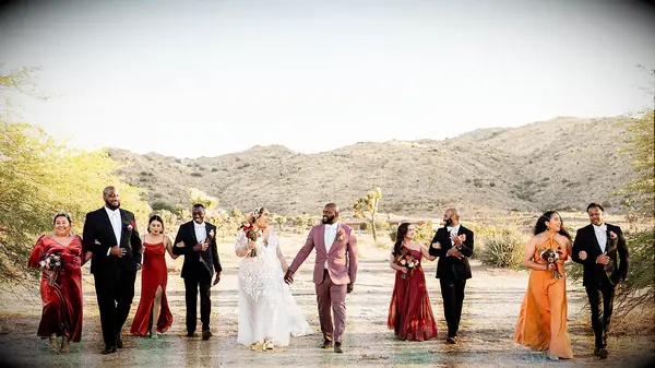 Wedding party in desert wearing sunset colors