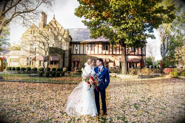 Happy couple posing outside the charming event space