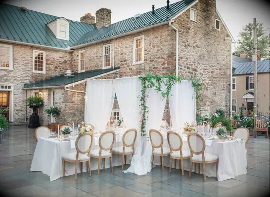 Outside wedding reception space beside stone venue