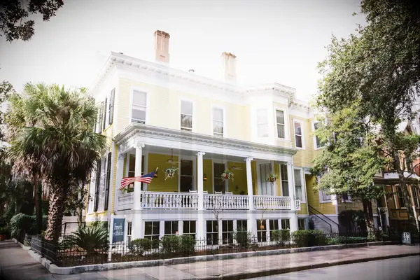 Yellow three-story b&b wedding reception