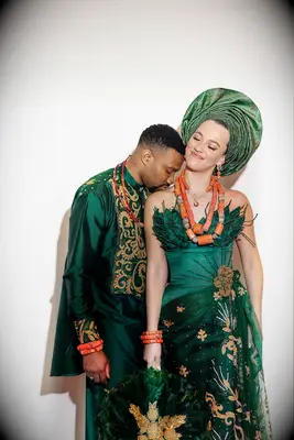 Bride and groom wearing Nigerian wedding fashion