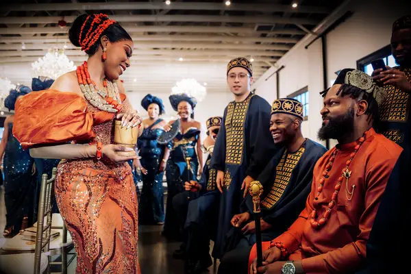 Nigerian bride doing wine-carrying ceremony.