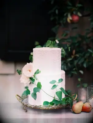 white two-tier wedding cake with white roses