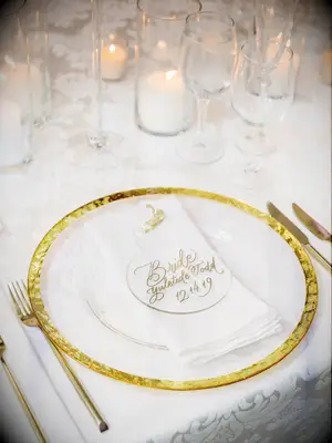 Acrylic Christmas tree ornament with gold writing.