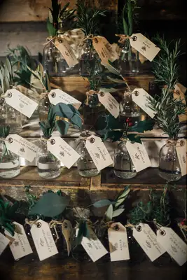 Herbal escort cards with sage, thyme and holly.
