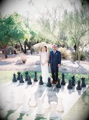Bride and groom with giant chess board