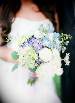 wedding bouquet with white, blue and green hydrangeas and blue delphinium
