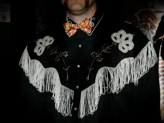 Groom in Western jacket at Taco Bell wedding