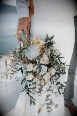 A gorgeous white flower and eucalyptus wedding bouquet