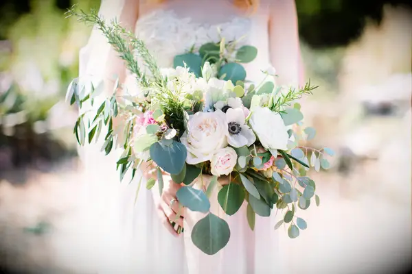 asymmetrical wedding bouquet with roses and eucalyptus