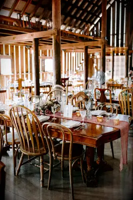 Mismatched Wooden Chairs barn wedding idea