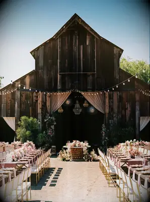 Rustic sweetheart table at barn wedding venue