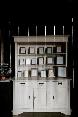 Picture Frame Seating Chart Display with Vintage Armoire