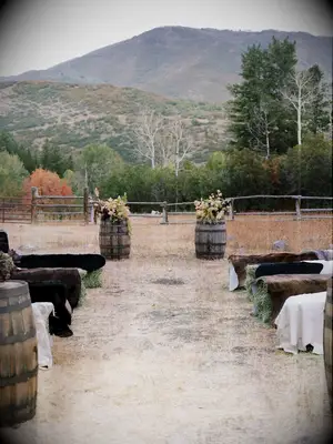 Wood Barrels Decorate the Altar for a Rustic Fall Wedding Ceremony