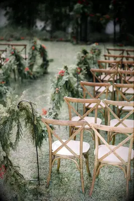Winter Garland Lined the Aisle for a Winter Wedding Ceremony