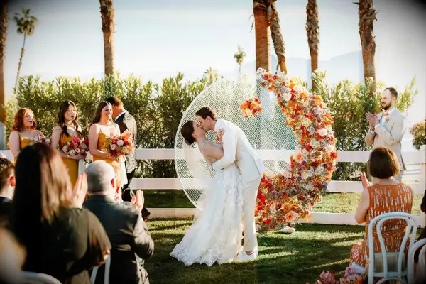 Circular Ceremony Arch With Vibrant Flowers