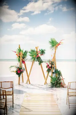 Colorful Florals Decorate This Unique Beach Wedding Ceremony Alter