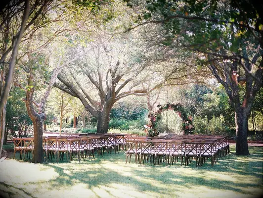 Woodland Garden Wedding Ceremony With Wood Chairs