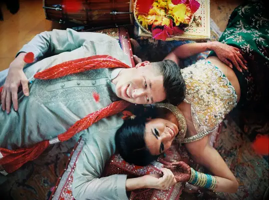 Bride and Groom Laying Down By Each Other at Wedding in Hawaii