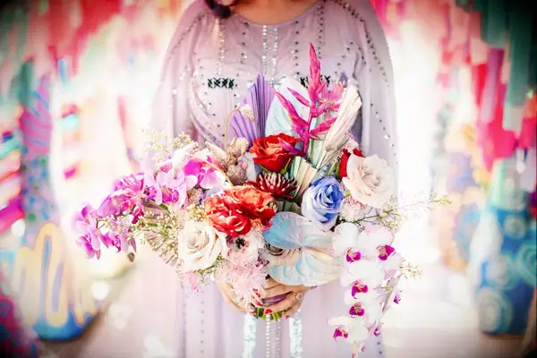 Bride in Purple Wedding Dress Holding Colorful Bouquet