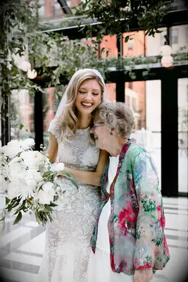Bride Laughing With Grandmother During Michigan Wedding