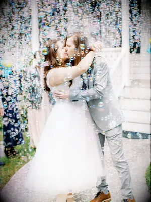 Couple Kisses During Bubble Grand Exit