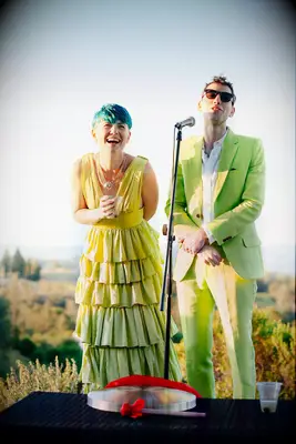 Couple in Neon Charteuse Outfits at Wedding Welcome Party
