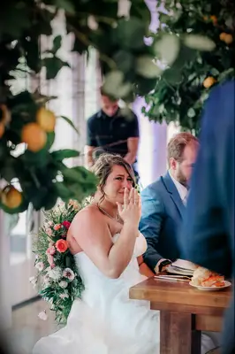 Bride crying during touching toasts at wedding reception