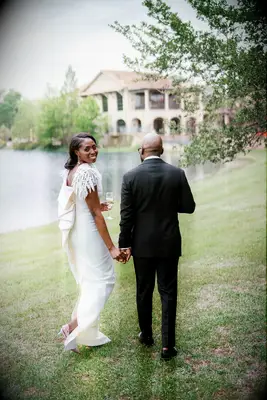 Couple Walking Beside Lake Post-Ceremony at The Club at Houston Oaks in Texas