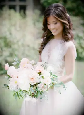 Bride holding romantic blush bouquet