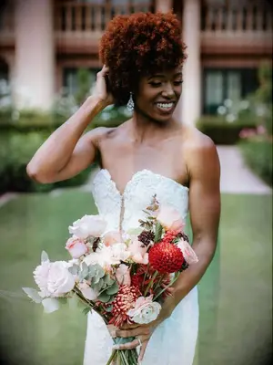 Bride holding pink-and-red bouquet