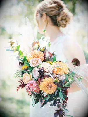 Bride holding dahlia bouquet